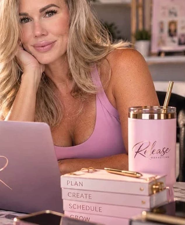 Lyndsay King at her desk with Release Marketing notebooks labelled Plan, Create, Schedule and Grow